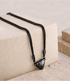 Magnetic heart necklace set with black cords and heart-shaped magnetic pendants