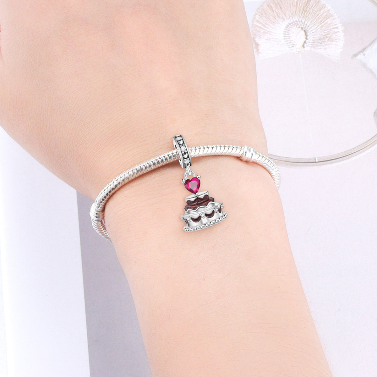 Silver charm bracelet with pink heart crown dangle